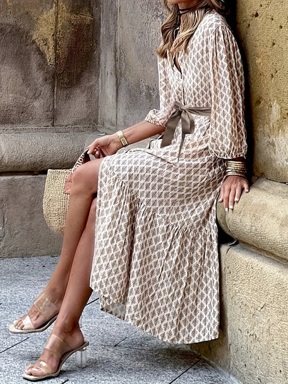 Isabella Jurk | Doorknoopjurk met Strikdetail, Subtiel Patroon en Elegante Pasvorm