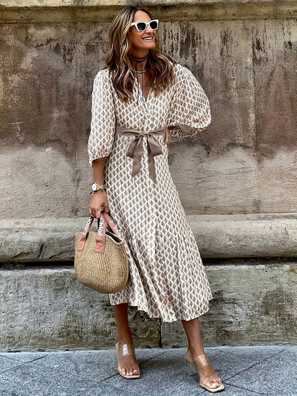 Isabella Jurk | Doorknoopjurk met Strikdetail, Subtiel Patroon en Elegante Pasvorm